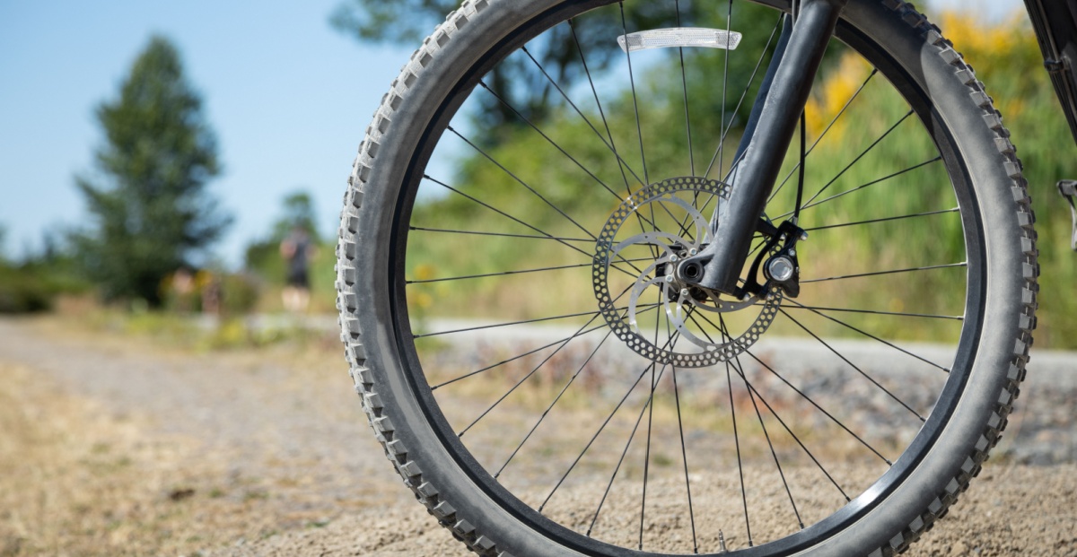 A bicycle tire, representing the hub-and-spoke model of California sports betting