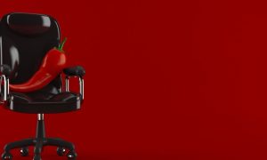A chile pepper on a chair, representing the launch of HotSeat Jackpot at Harrah's Northern California