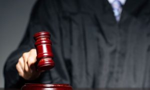 Judge with a gavel symbolizes Win-River Casino proposal heading to court in Shasta County