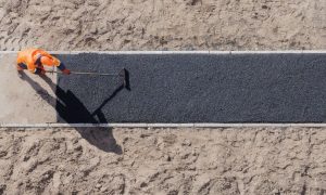 Someone paving a road symbolizes Tulare Co. paving way for future gaming expansion