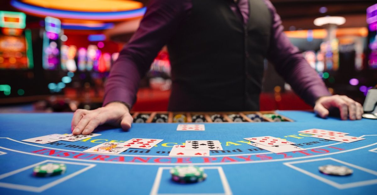 Blackjack dealer and table signifying passage of CA SB549, allowing tribes to sue cardrooms