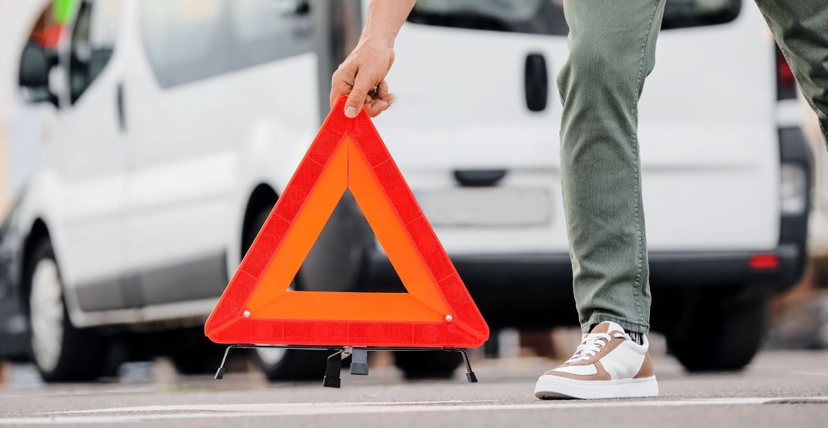 a warning sign put in front of a car